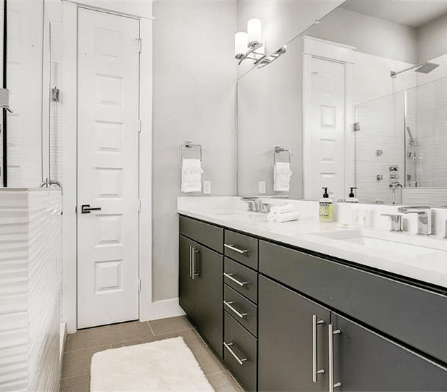 Primary bedroom en suite bathroom with upgraded shower system and walk in shower.  Separate soaker tub, double vanity, and private toilet area available.