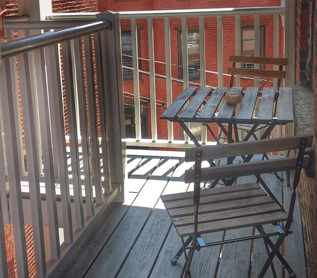 This is off the kitchen a little outside space.There is actually 4 chairs