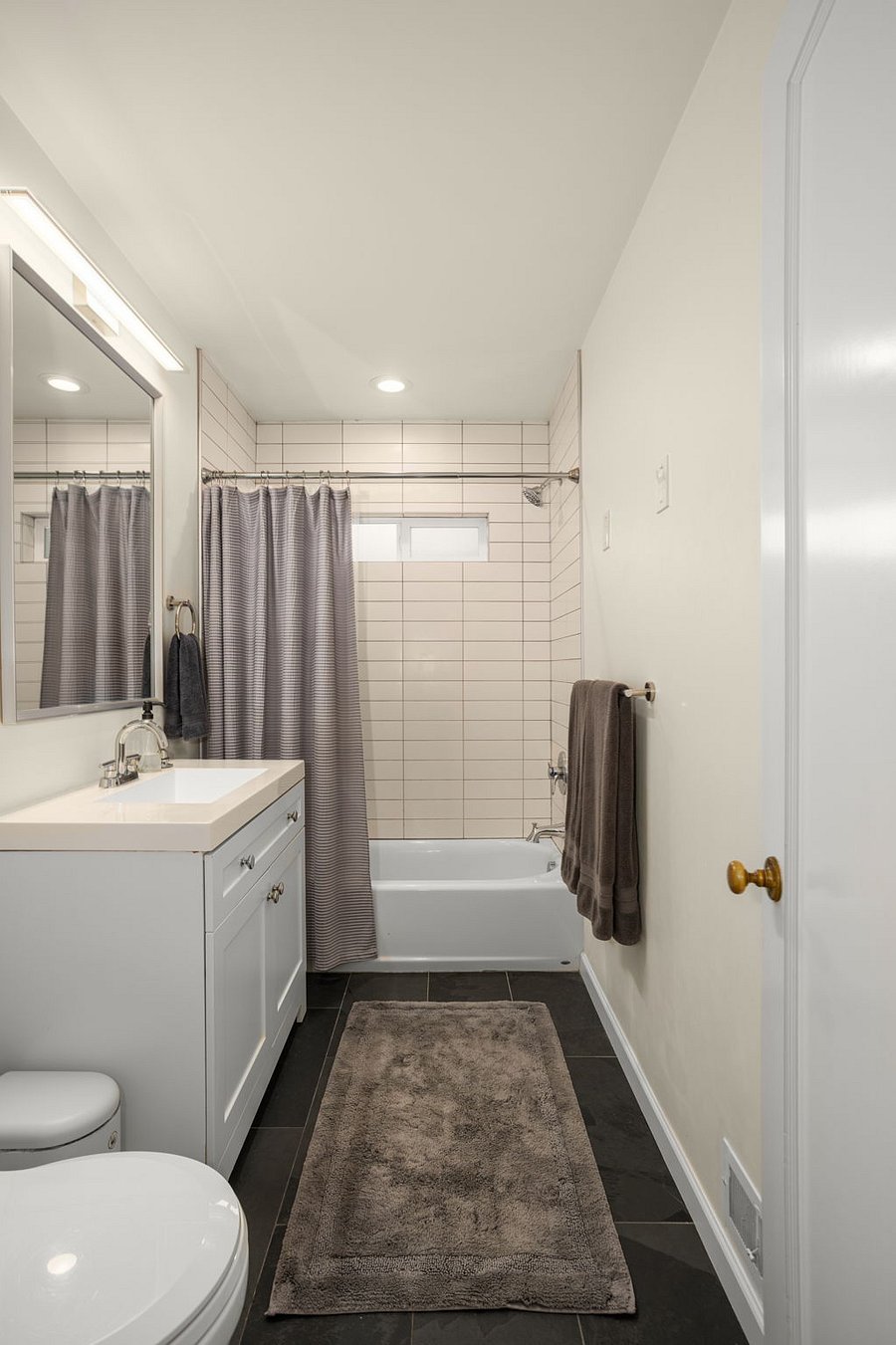 Main floor bathroom with shower and tub