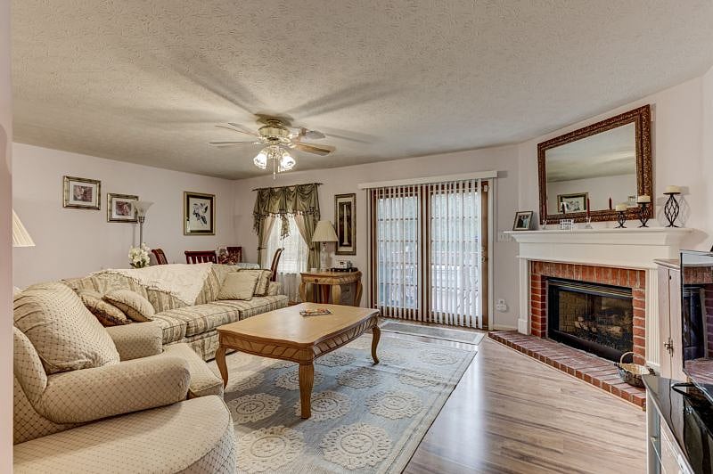 Living room is bright and airy with double sliding glass doors to let in the sunshine