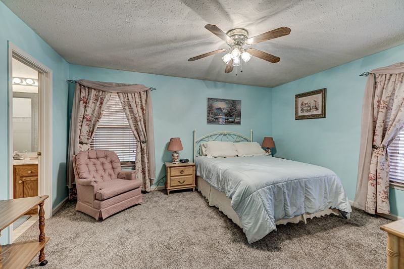 Master bedroom with easy rocker to relax in