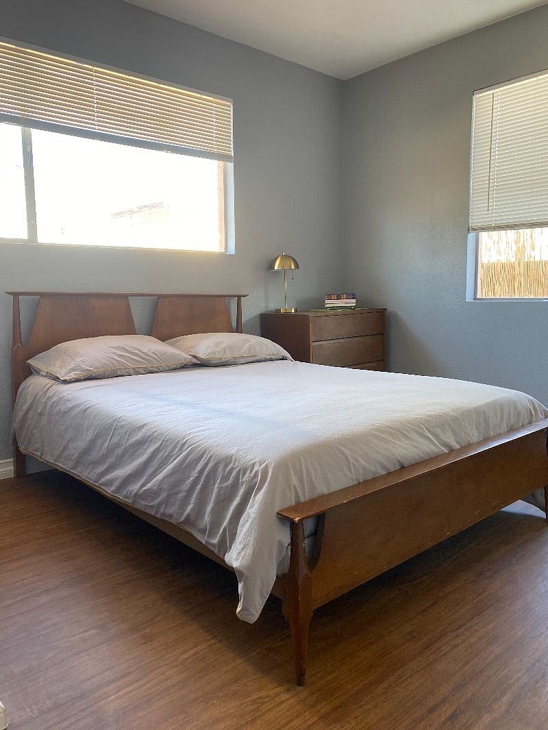 Master bedroom with full bed and en-suite bathroom.
