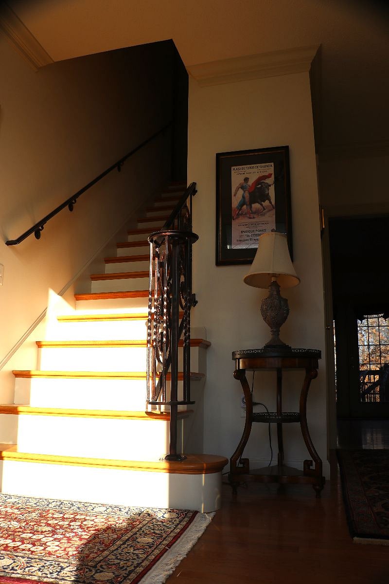 As you enter through the front door, the bedrooms and laundry are upstairs. The living room is straight back to the right of the stairs. The dining room is to the left of the stairs. The kitchen is on the other side of the dining room.
