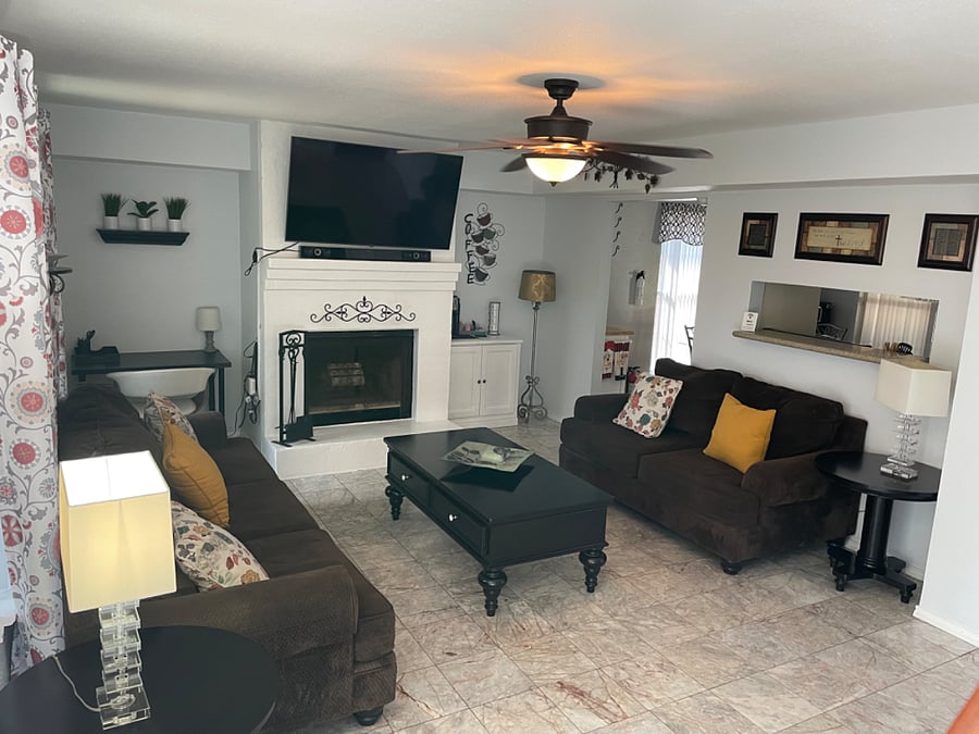 Living Room with plenty of sitting, desk to do work, coffee station and smart 55in TV.