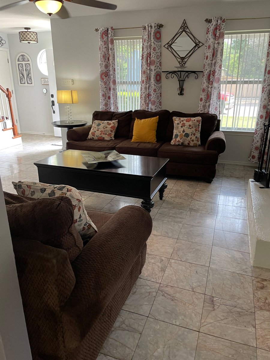 Living Room with plenty of sitting, desk to do work, coffee station and smart 55in TV.