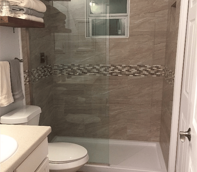 Guest full bathroom, co located with laundry room with washer and dryer.