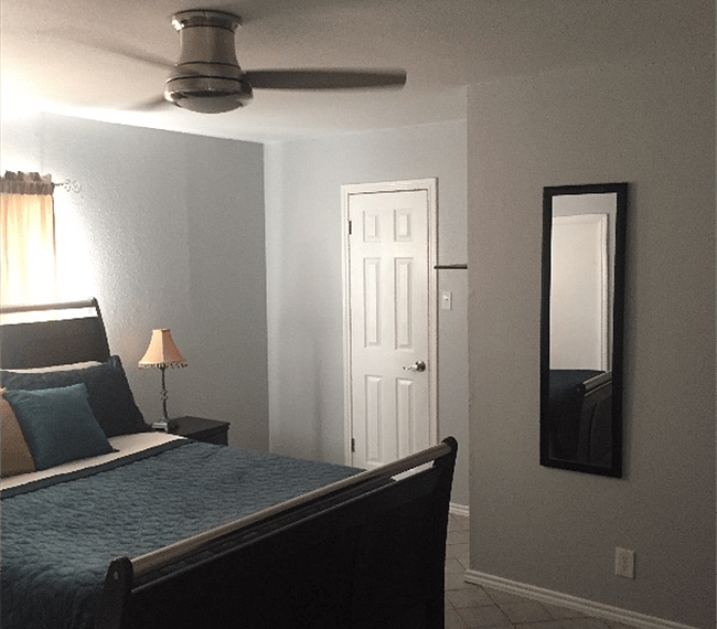Master bedroom with full length mirror
