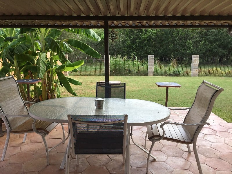 Enjoy the outside Texas air with plenty of seating under covered back porch.