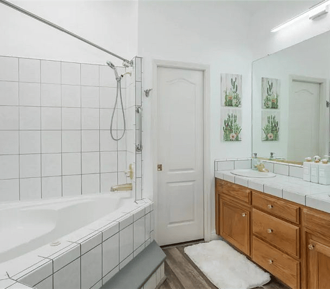 A shower and bath combo features in the bathroom