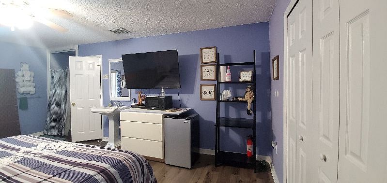 This is one of our four bedrooms, "New King Room" each with their own private restroom and showers. This particular room is Room E and features a king size, adjustable bed and pull out couch.