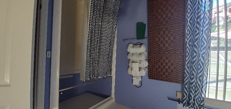 This is one of our four bedrooms, "New King Room" each with their own private restroom and showers. This particular room is Room E and features a king size, adjustable bed and pull out couch.