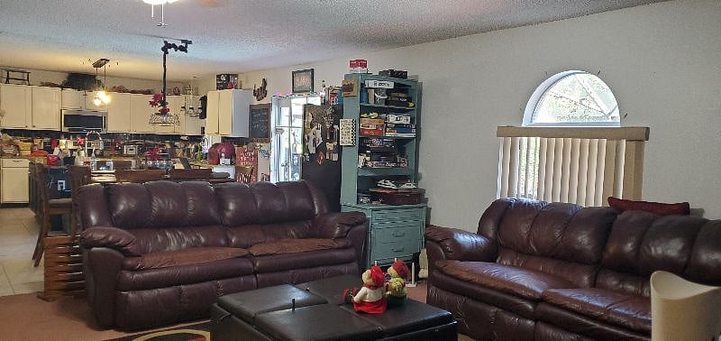 Our family room is one of three public areas in our home to relax. We have this family room with large screen TV, a living room and another family relaxing type open bonus room on the second floor, also with a large screen tv.