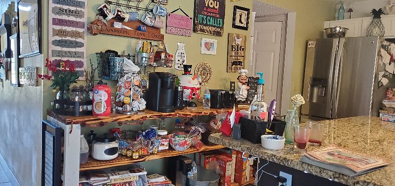 Breakfast bar with all day keurig coffee, water bottles, waffle cookers, peanut butter, honey, nutella, bagels, english muffins and the like. (stocked items subject to change)