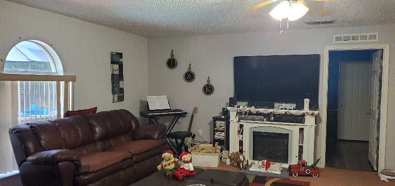 Our family room is one of three public areas in our home to relax. We have this family room with large screen TV, a living room and another family relaxing type open bonus room on the second floor, also with a large screen tv.