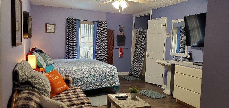This is one of our four bedrooms, "New King Room" each with their own private restroom and showers. This particular room is Room E and features a king size, adjustable bed and pull out couch.