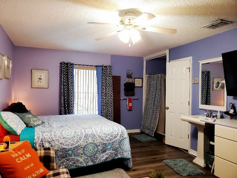 This is one of our four bedrooms, our "New King Room" each with their own private restroom and showers. This particular room is Room E and features a king size, adjustable bed and pull out couch.