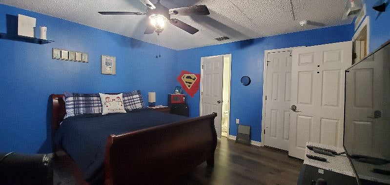 This is one of our four bedrooms, each with their own private restroom and showers. This particular room is Room A, our "Queen" room. and features a queen size, adjustable bed, desk and large screen TV.