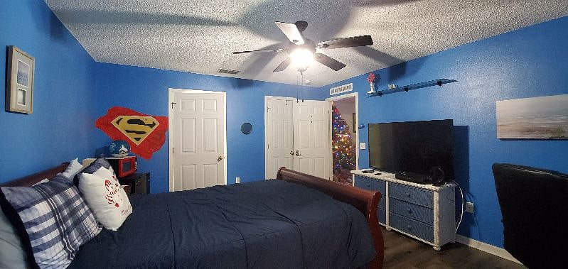 This is one of our four bedrooms, each with their own private restroom and showers. This particular room is Room A, our "Queen" room. and features a queen size, adjustable bed, desk and large screen TV.