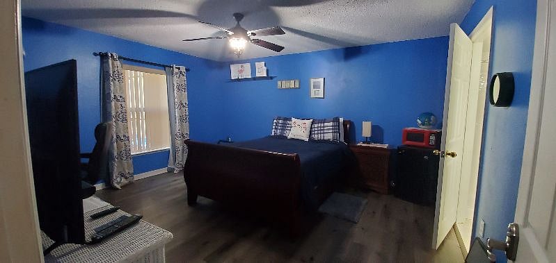 This is one of our four bedrooms, each with their own private restroom and showers. This particular room is Room A, our "Queen" room. and features a queen size, adjustable bed, desk and large screen TV.