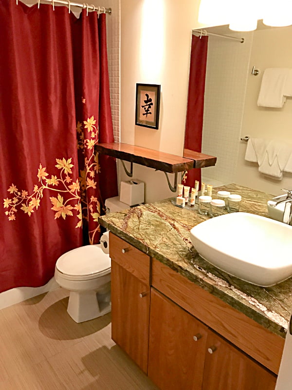 Bath features a large shower tub with Jacuzzi.