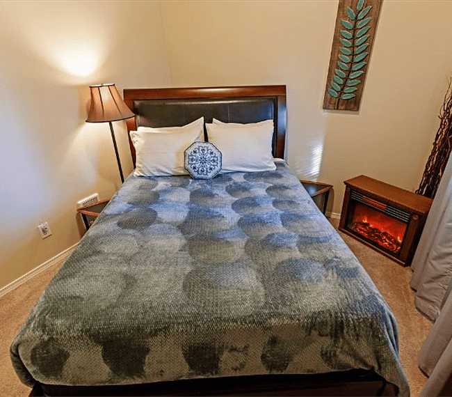 Second Bedroom with Comfortable Queen Memory foam mattress and Cute Electric Fireplace for Cool nights or Just flames for ambiance