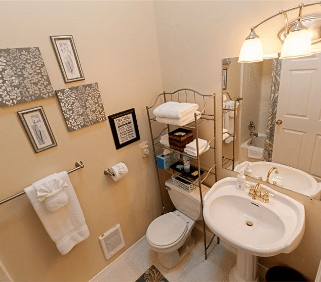 Sink and Toilet view of Main Bathroom