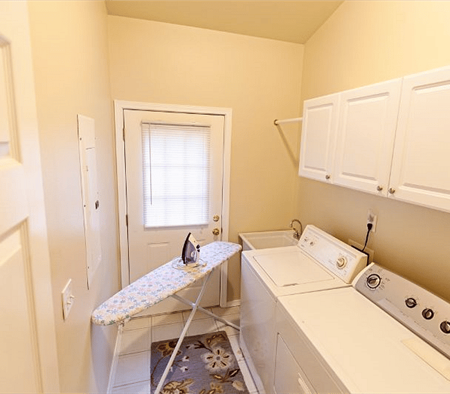 Laundry room with Large Wash Tub, and Iron and Ironing board.
