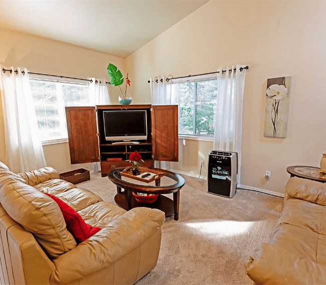 Inside the Living room looking out towards the Front and side yard