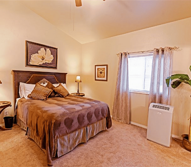 Master Bedroom with portable upright A/C during the summer.