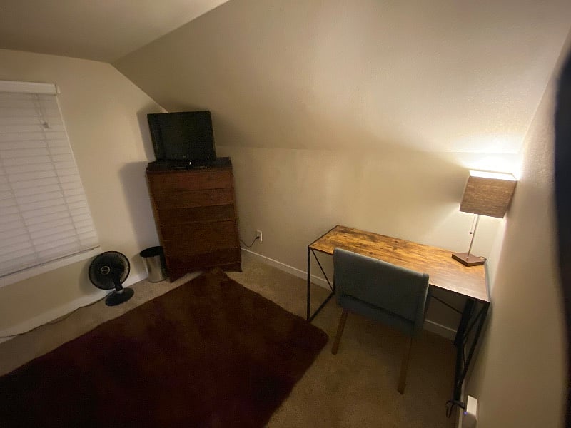 Bedroom #2 (upstairs on the left) has an antique dresser with 6 spacious drawers, a tv with local channels and a nice work space with a new desk, new chair and lamp.