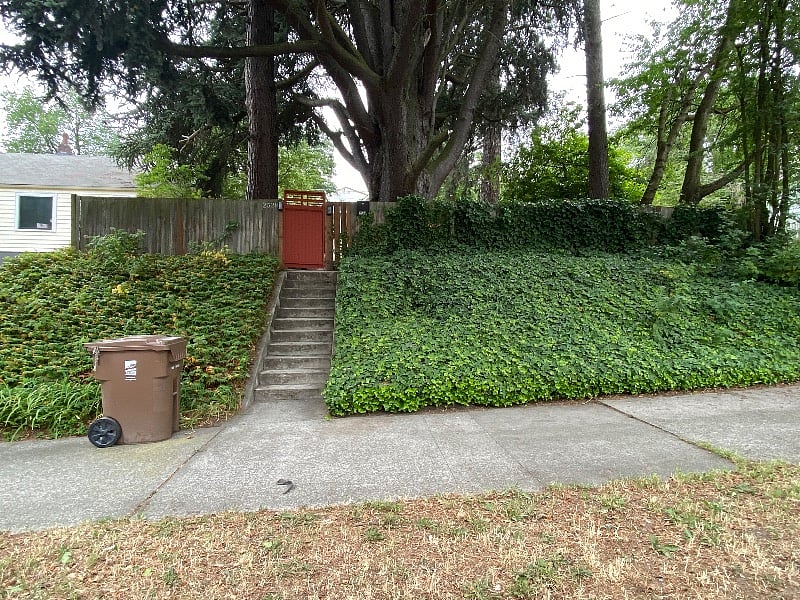 View of the front gate entrance to my property, taken from the street parking area.