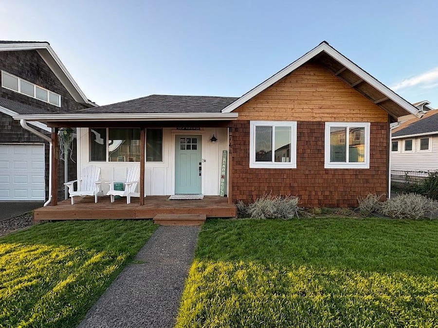 Cedar shake exterior adds to the charm of the home. The Adirondack chairs allow you the ability to relax and enjoy the sights and sounds of the ocean from the front porch.