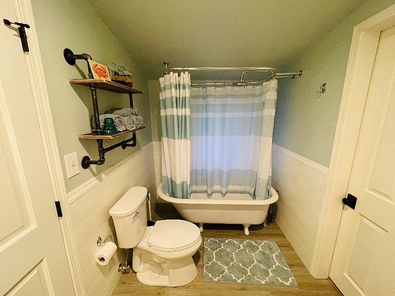 Original claw foot tub with rain fall shower. 