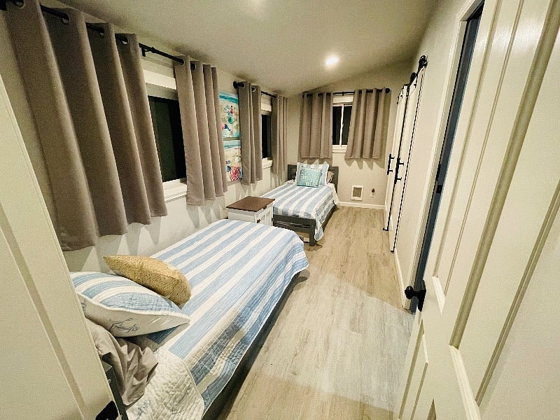 Second bedroom with 2 twin beds and black out curtains. 