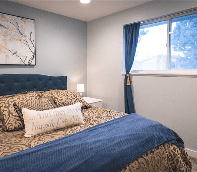 Master bedroom (bed in picture is not currently in home; currently has queen mattress, sheets and comforters). blackout curtains included