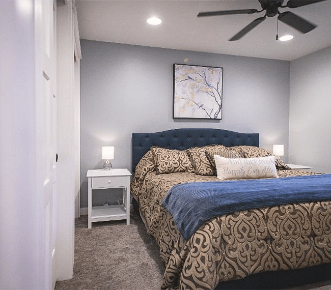 Master bedroom (bed in picture is not currently in home; currently has queen mattress, sheets and comforters). blackout curtains included