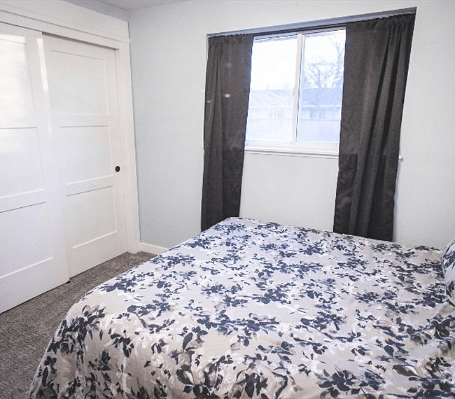 guest bedroom #1. this bed currently in home, queen size. blackout curtains included