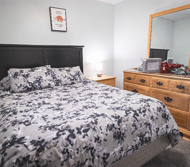 guest bedroom #1. this bed currently in home, queen size. blackout curtains included