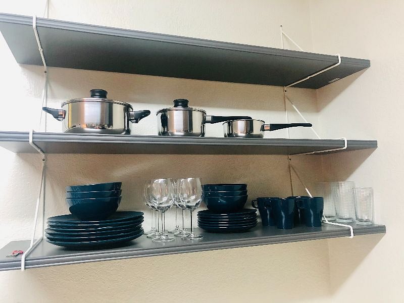 Kitchenware: Plates, cups, glasses, eating utensils, cooking utensils.