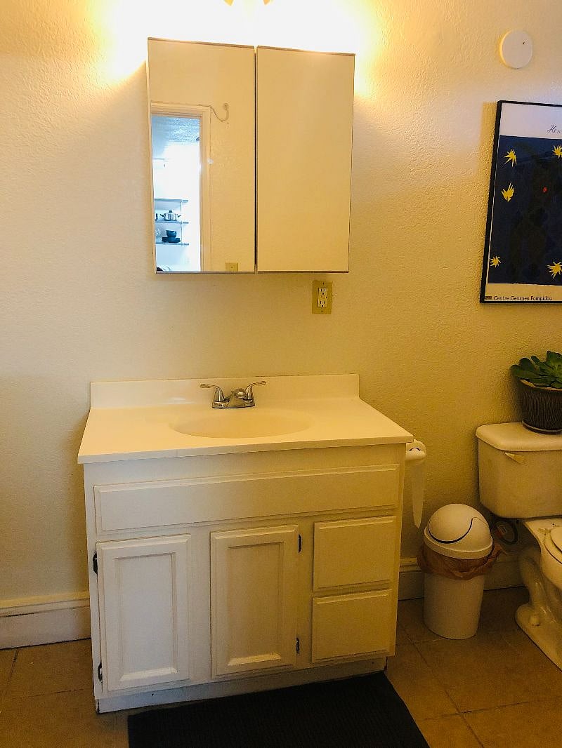 Bathroom has ample storage. Medicine cabinet and under the sink cabinet both can hold plenty of storage.