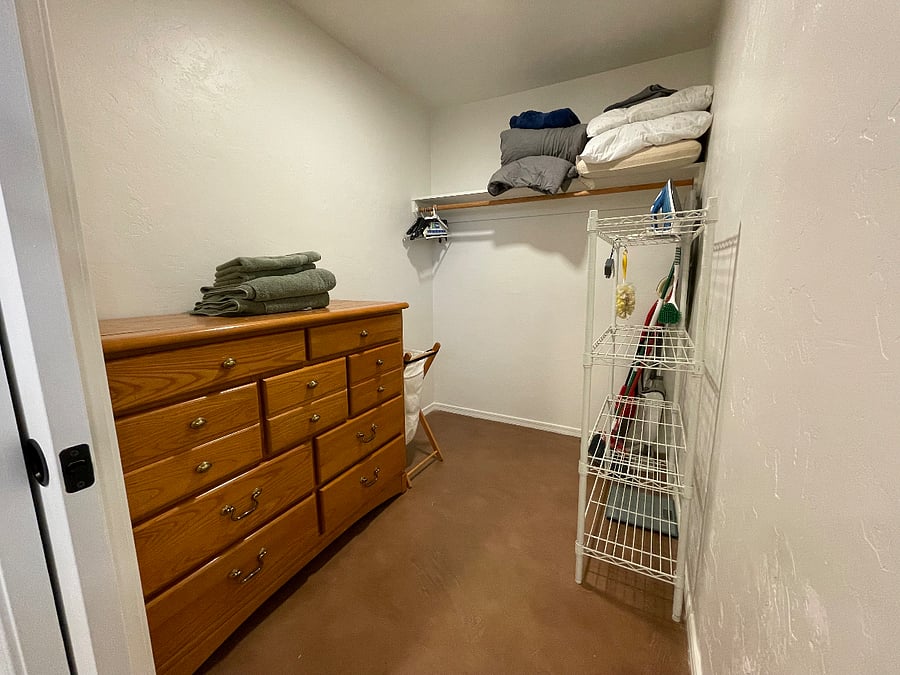Large walk-in closet with plenty of storage.