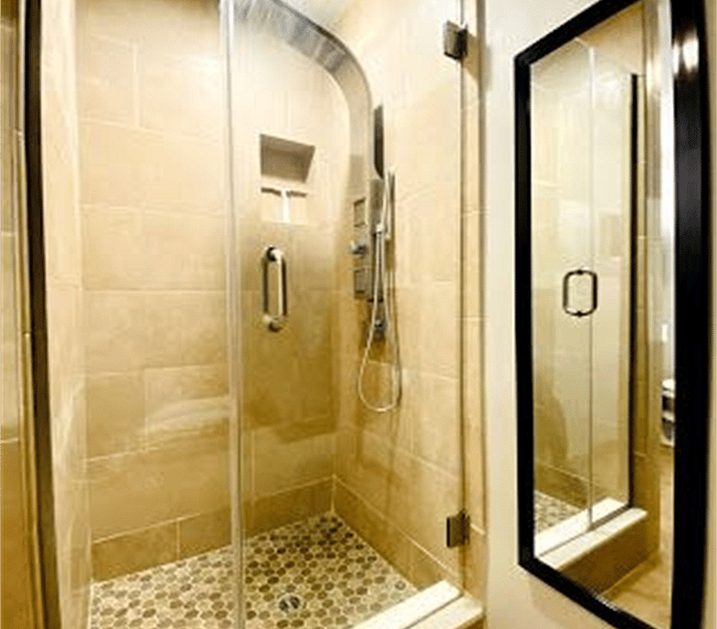 Modern bathroom with massage showers and additional closet space!