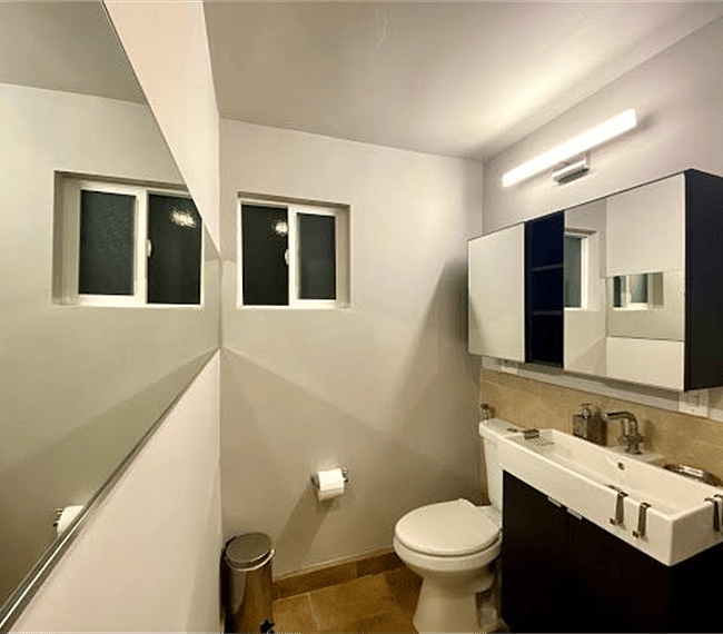 Modern bathroom with massage showers and additional closet space!