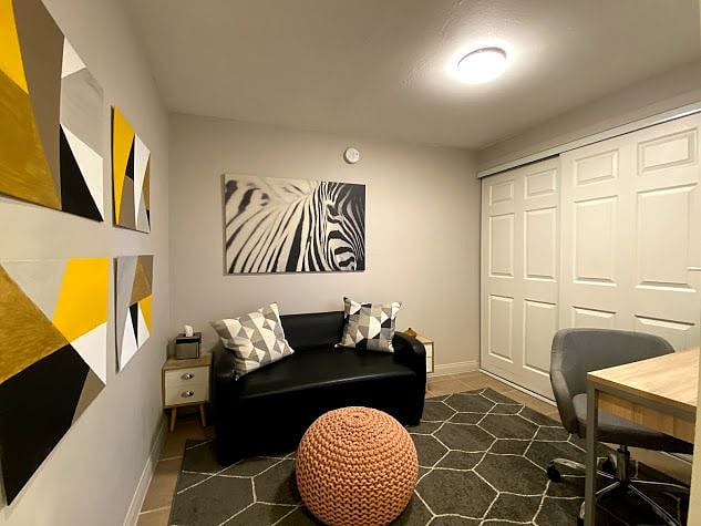 Office / Guest Room with desk, sleeper sofa and walk-in closet!
