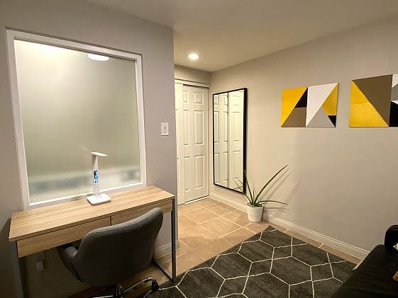 Office / Guest Room with desk, sleeper sofa and walk-in closet!
