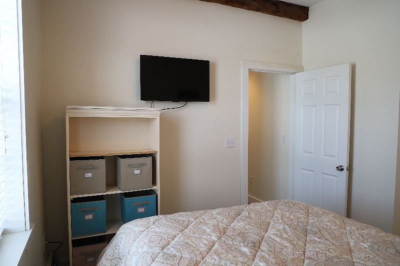 Unit B Bedroom 2nd View with TV and storage chest
