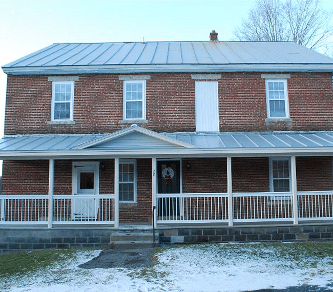 Front of the building, Green door is the entry for the upstairs apartments