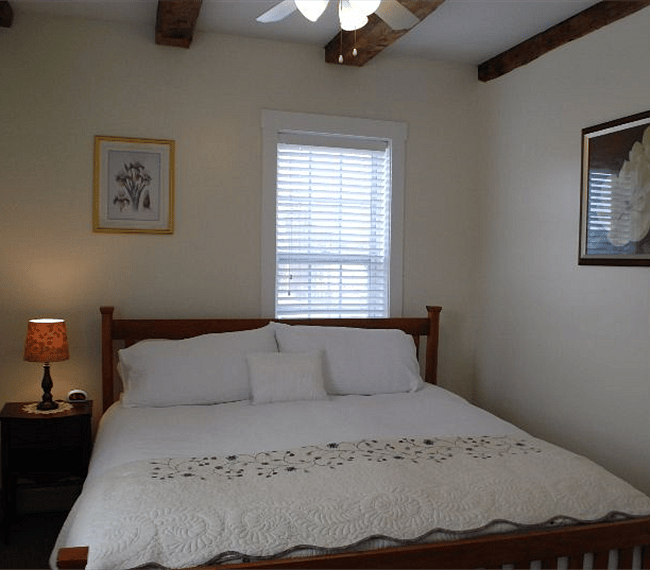 Unit C Bedroom with King Size Bed and TV