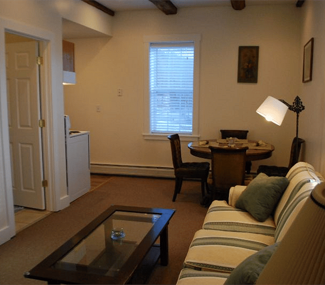 Living room view to kitchen and dining