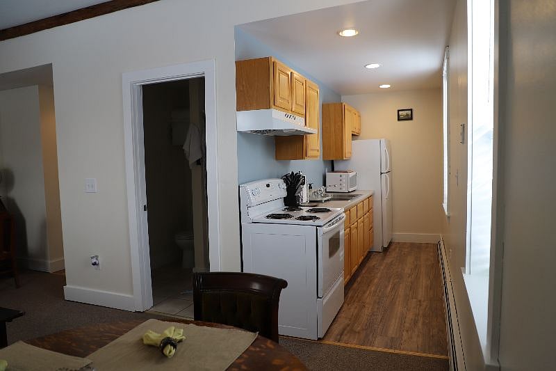 Unit C Kitchen with batroom door on the left.
